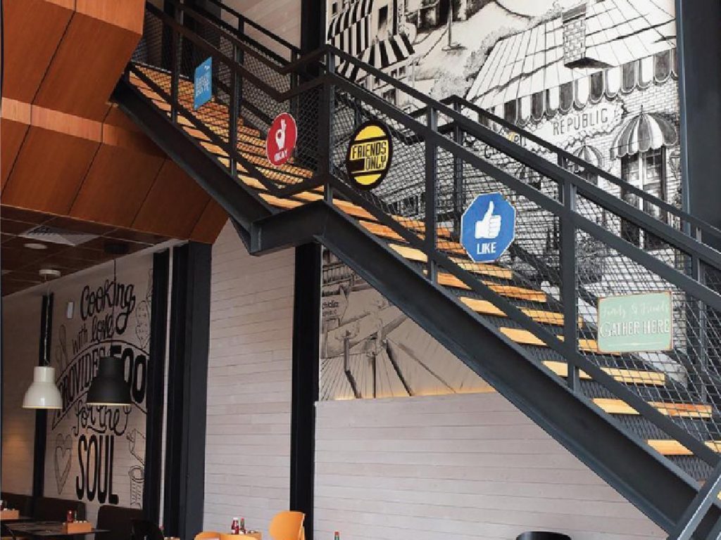 Family-friendly restaurants in Jeddah: Chicken Republic restaurant stairs and dining hall